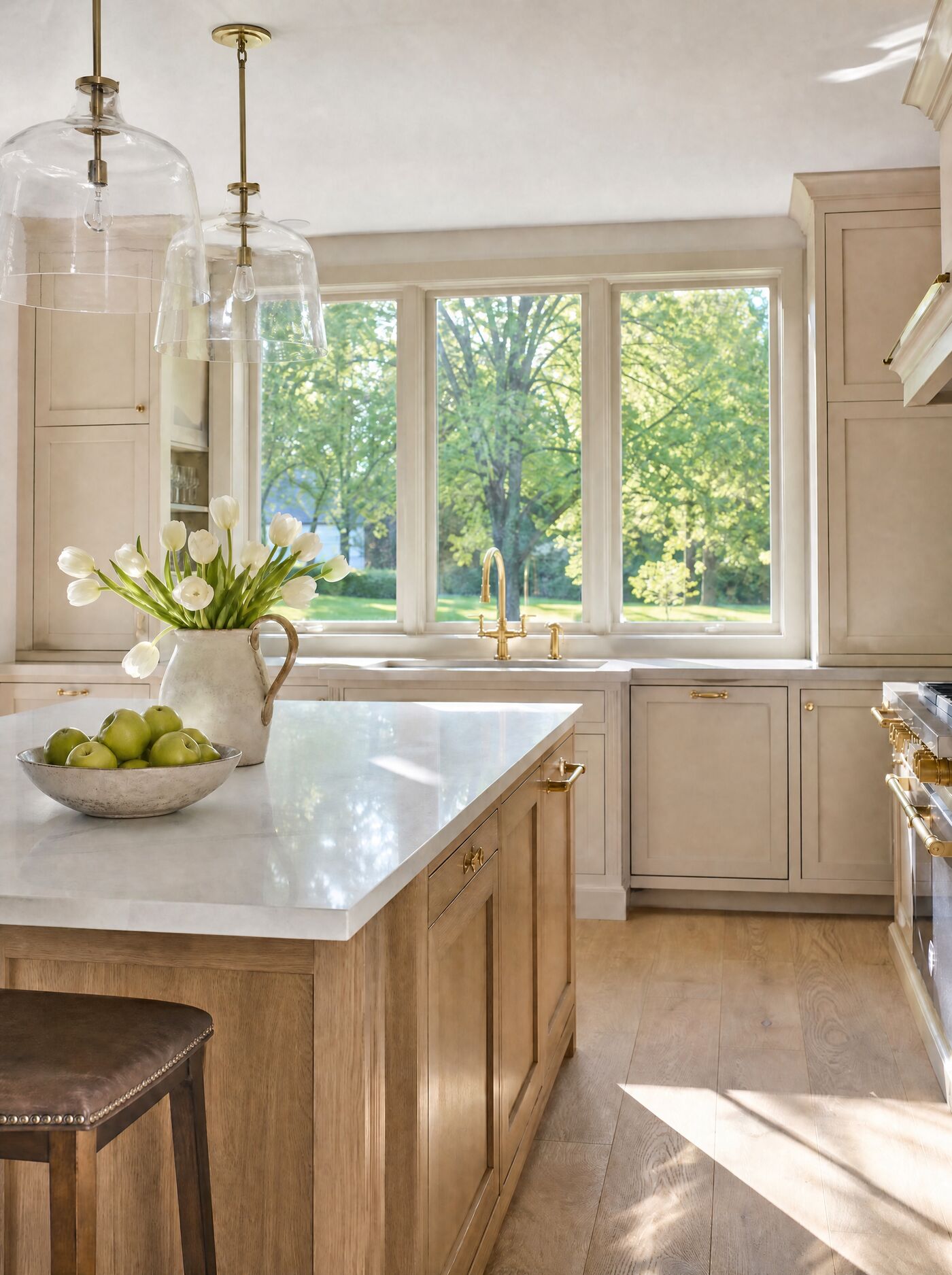 Illustration of a calm kitchen with ivory cabinetry and a white oak island